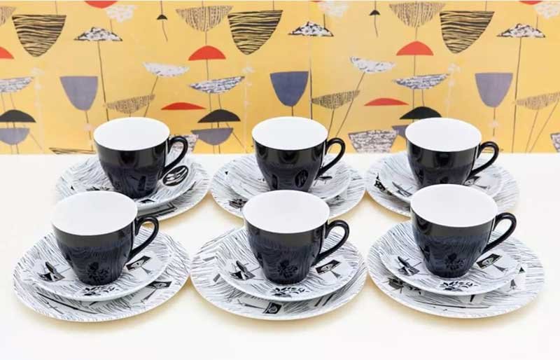 Six black and white collectable tea cup props.